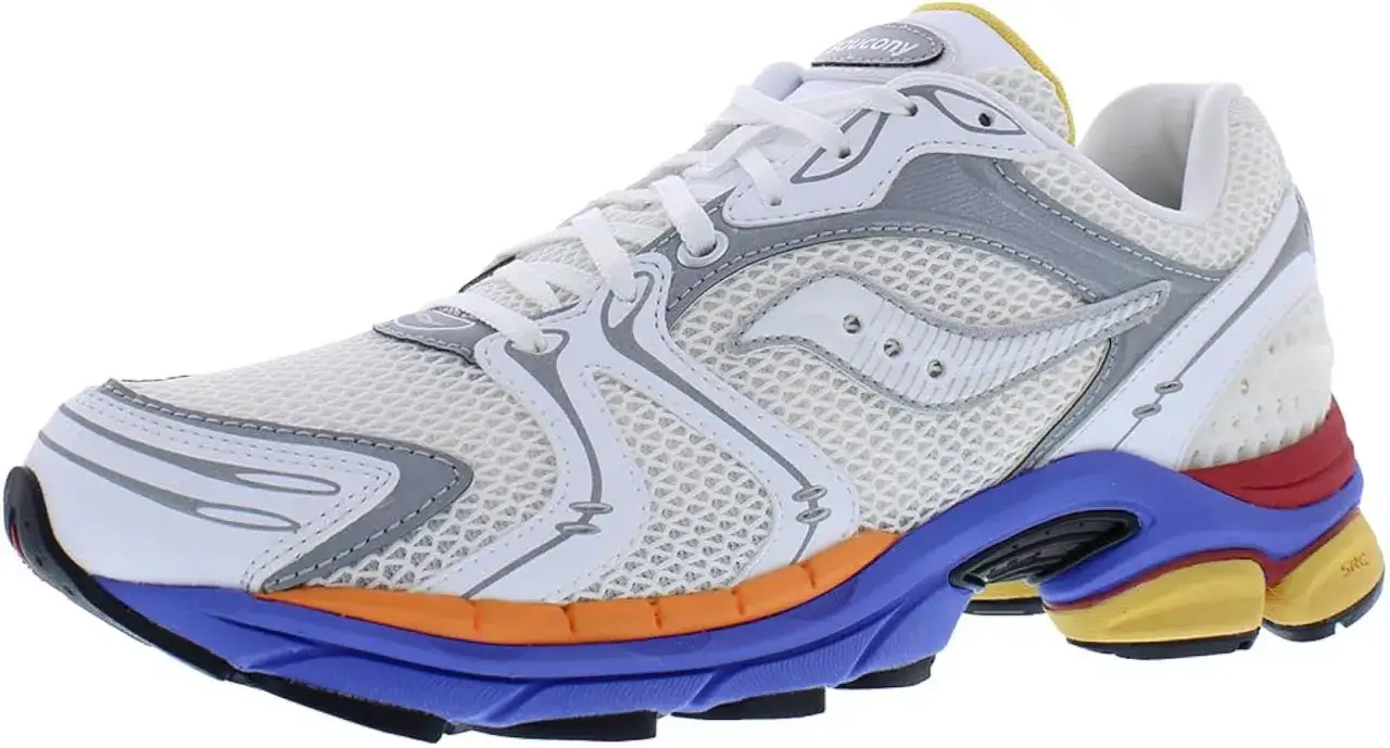 Chaussure de course Saucony Progrid blanche et grise avec semelle extérieure multicolore audacieuse.