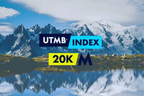 Paysage alpin avec le logo UTMB INDEX et 20K M. Reflets sur l'eau.